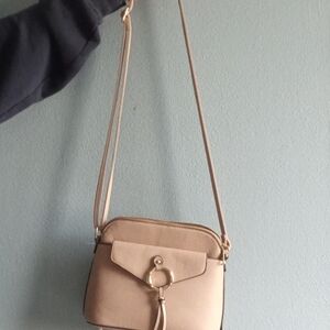 Tan Crossbody Bag with Tassel Detail and Adjustable Strap